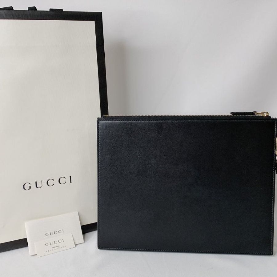 GUCCI 燙金Logo黑色皮革手拿包-1