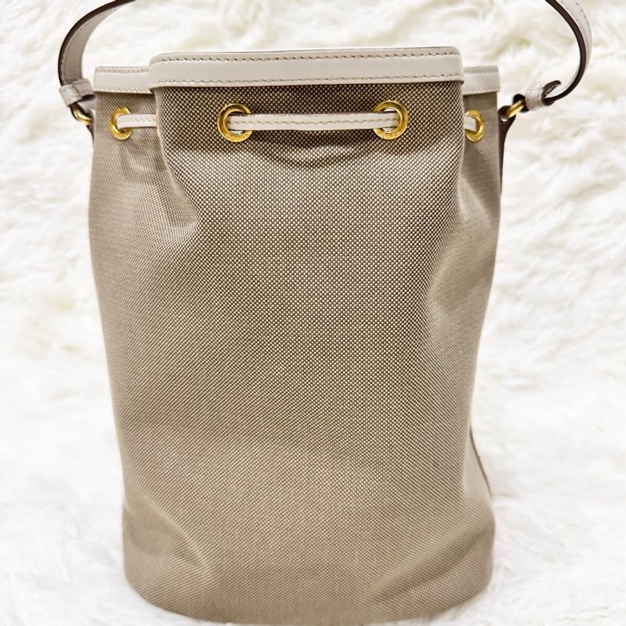 PRADA 緹花刺繡LOGO蝴蝶結設計帆布束口手提斜背水桶包-1