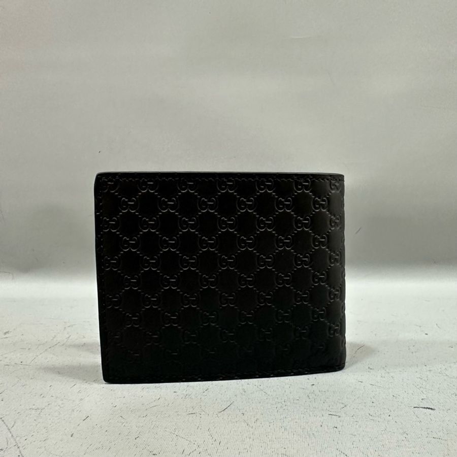 Gucci 260987 黑色牛皮壓紋GG短夾-1