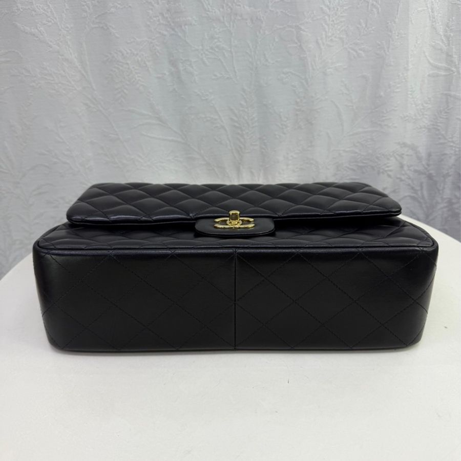This is a Chanel Classic Double Flap bag in black leather with gold-tone hardware-6