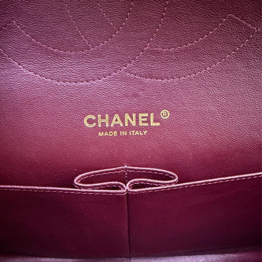 This is a Chanel Classic Double Flap bag in black leather with gold-tone hardware-13