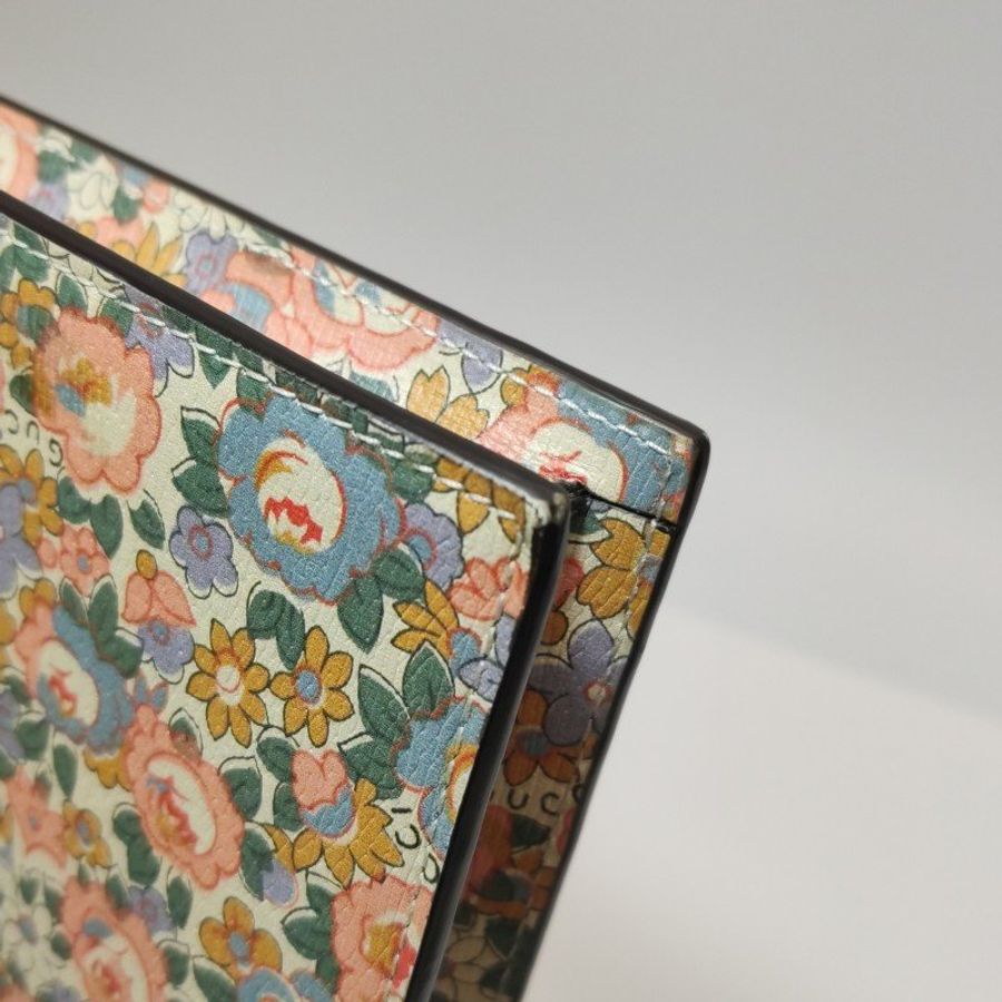 Gucci牛皮花卉滿印字母Logo拉鏈手拿包-14