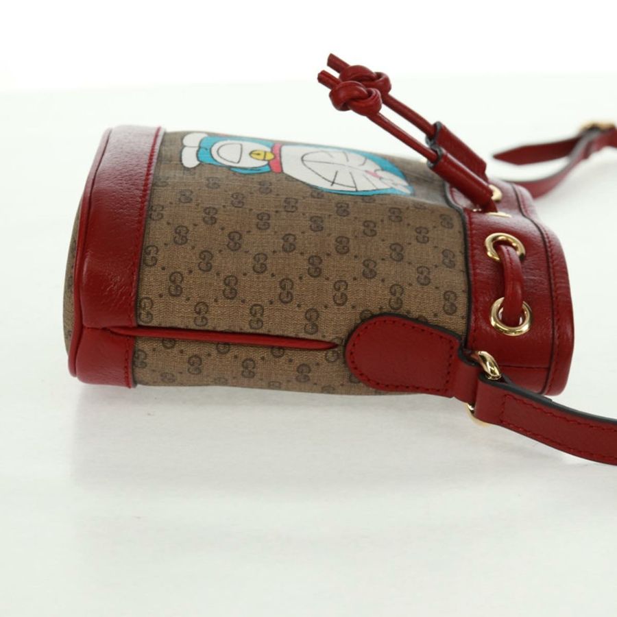 【日本直送】GUCCI 哆啦A夢迷你GG Supreme單肩包 PVC 米色 金色 647801 正品 168092M-4