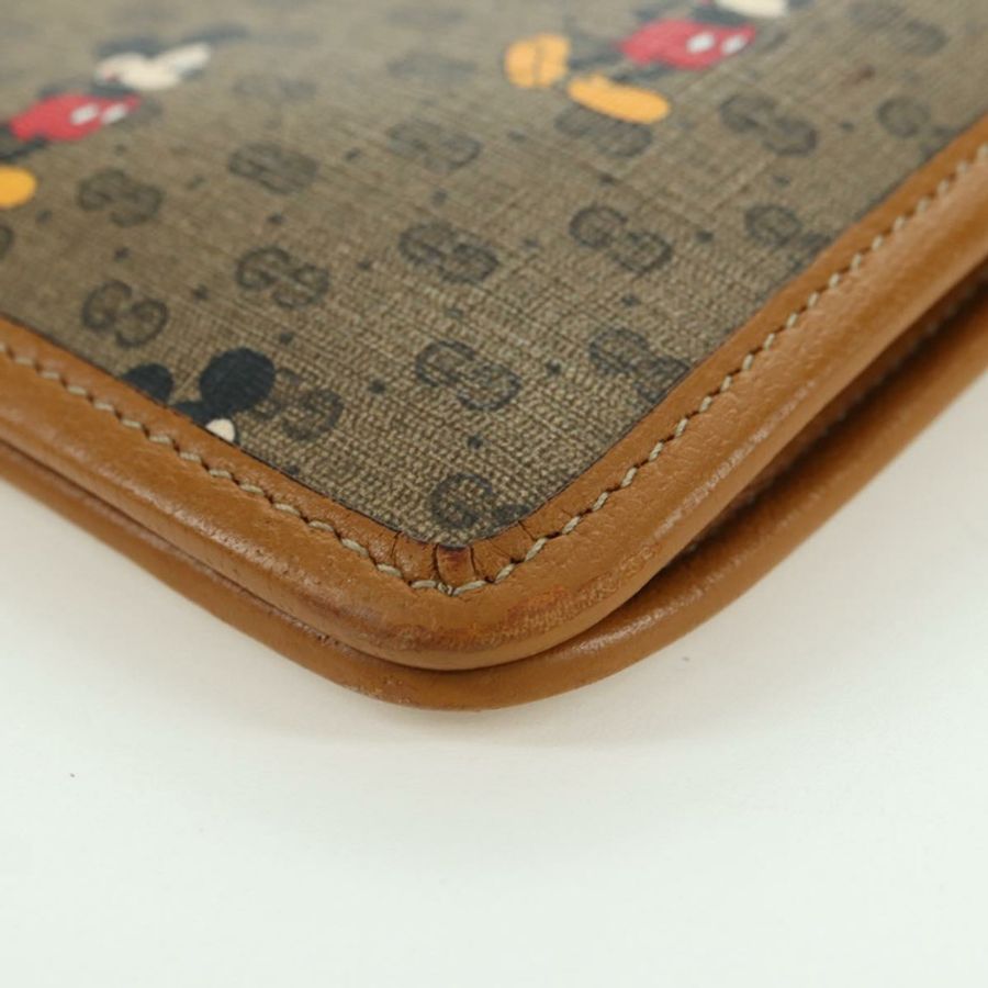 【日本直送】GUCCI GUCCIxDisney GG Supreme 手拿包 PVC 米色金色 602552 正品 YKZ1330M-13