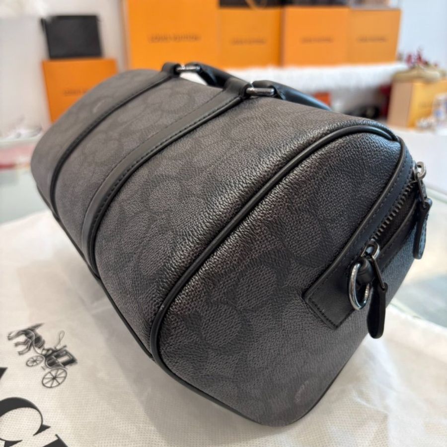 Coach經典老花VENTURER 27號斜背手提行李袋-6