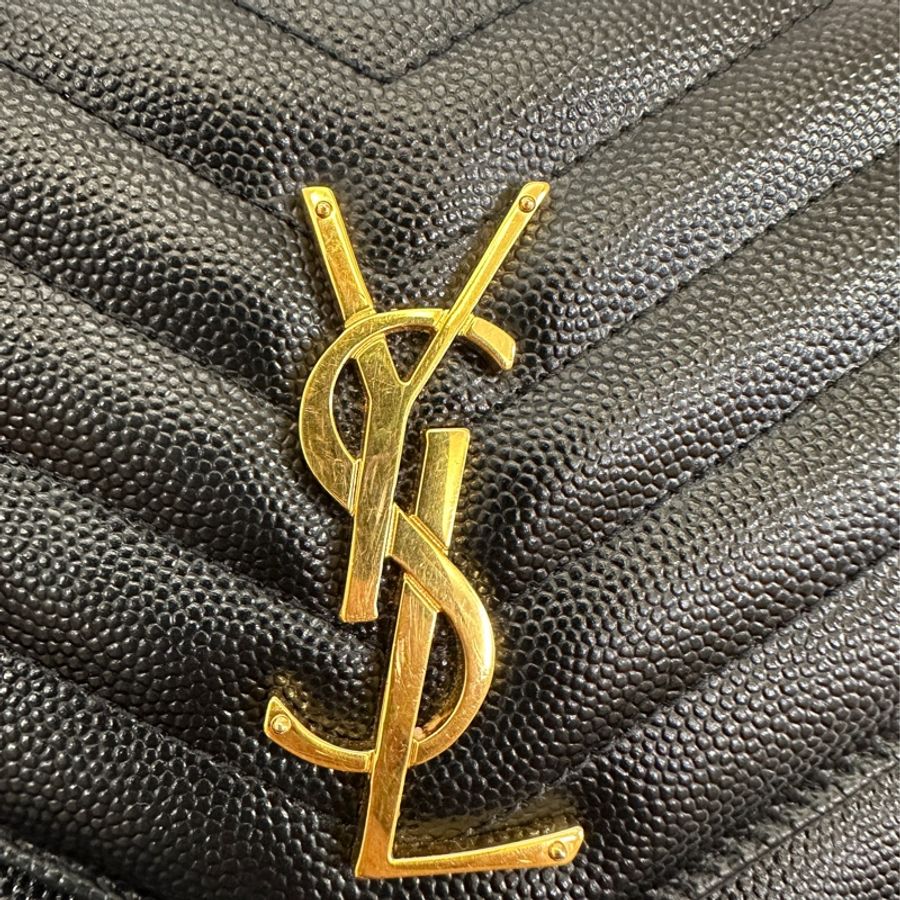 YSL  黑魚子醬牛皮金釦 WOC-9
