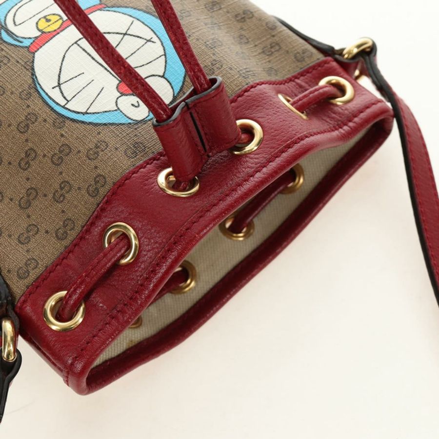 【日本直送】GUCCI GUCCI × Doraemon 聯名款 Micro GG Supreme 手提包 PVC 米色 金色 647801 正品 185900M-7
