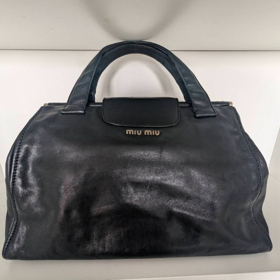 Miu Miu Vitello 黑色小牛皮金屬轉扣手提公事包-1
