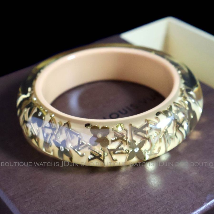 金鐸精品~2543 LOUIS VUITTON LV路易威登M65607金色字紋圓花透明與杏仁色壓克力寬版手環-0