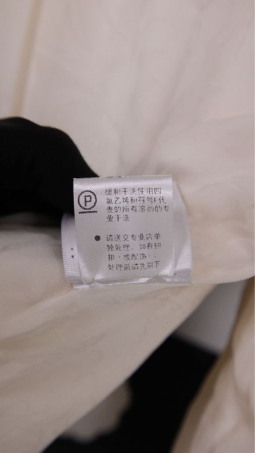 Chanel 10年田园音乐会系列秀款米白色圆领金扣侧比开衩上衣外套-19