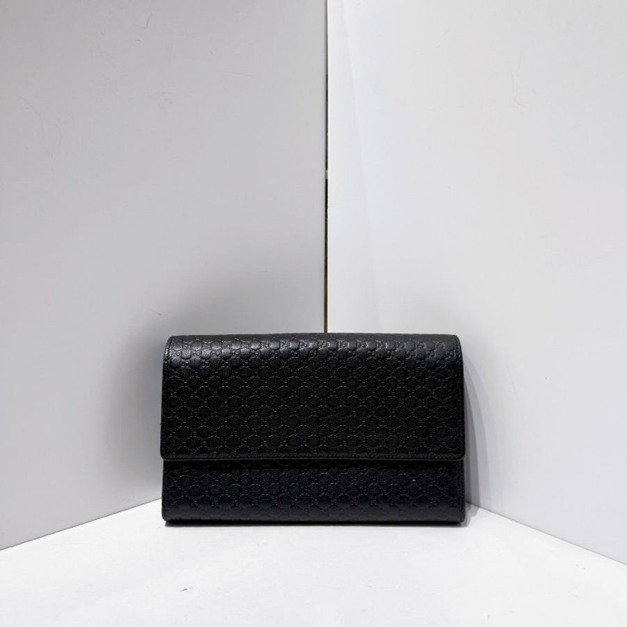 Gucci 壓紋logo老花黑銀配色手拿包-1
