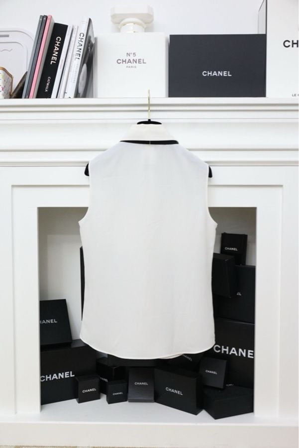 Chanel白色两口袋黑色蝴蝶结马甲背心上衣-2