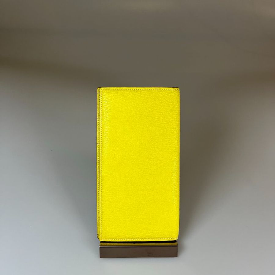 HERMES □O刻 檸檬黃洞洞對折長夾-1